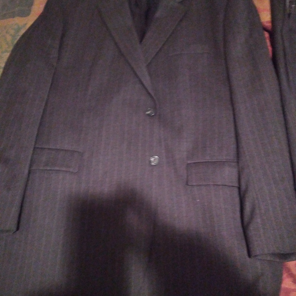 A Dark Gray Pinstripe 2Button 50L Suit. 44/32 Pleated Pants w Cuff.